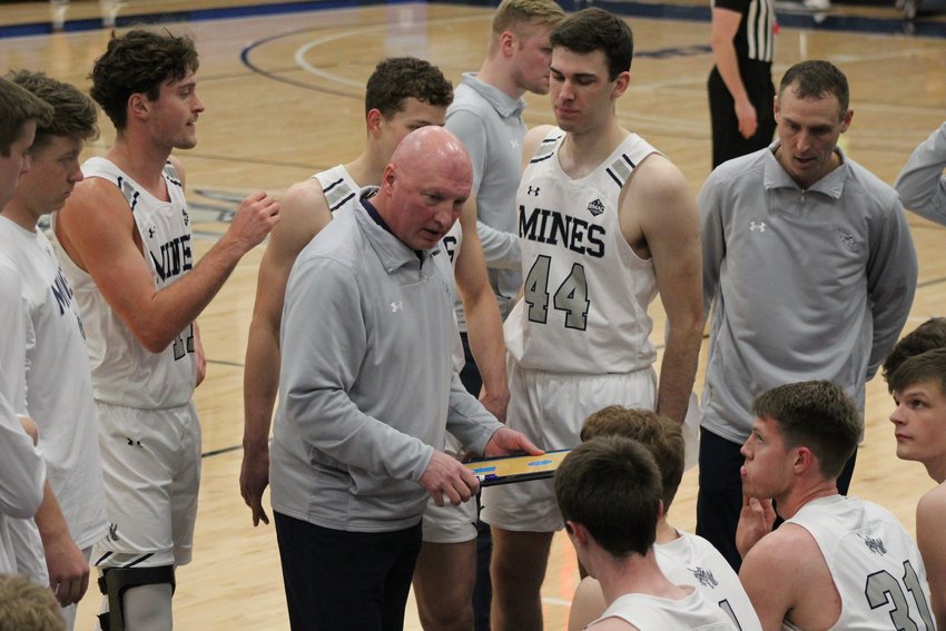 Mines coach Pryor Orser gives his team instructions during a second-half timeout during the Jan. 27 home game against Fort Lewis.